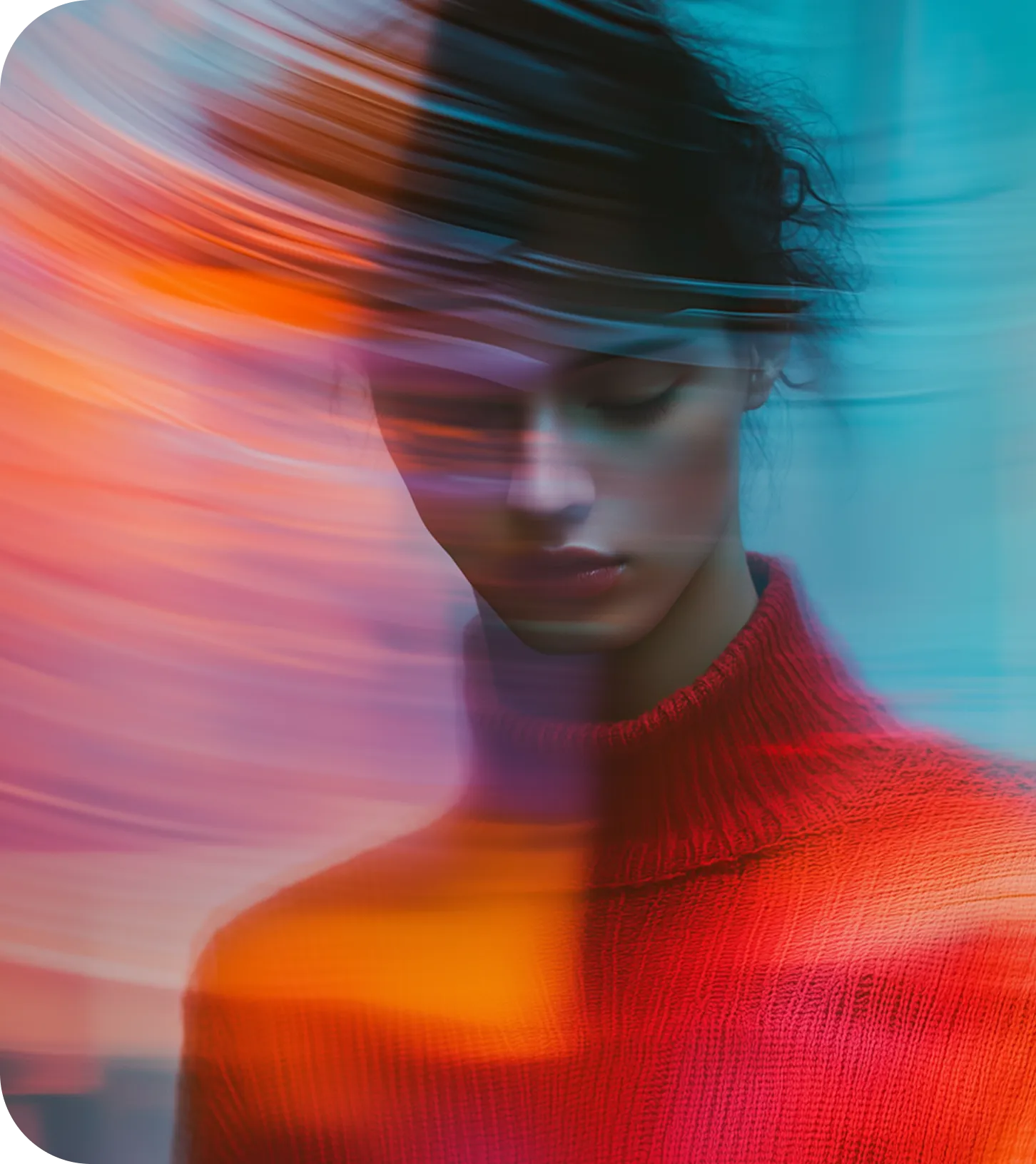 Portrait of a woman in a red turtleneck sweater with her eyes closed, surrounded by colorful light streaks creating a blurred effect.